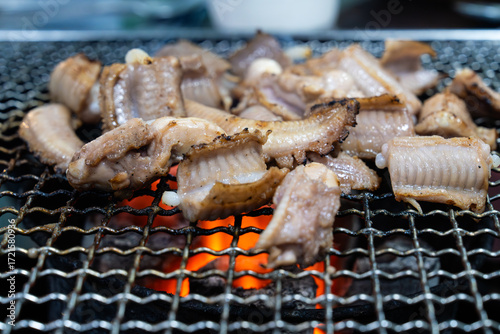 roasting hagfish (sea eel) on the charcoal grill