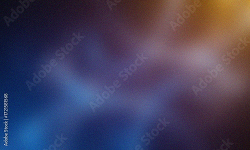 Abstract blurred background with blue purple and gold hues and grainy texture image