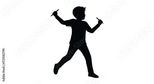 Silhouette of a joyful child running and playing with arms raised