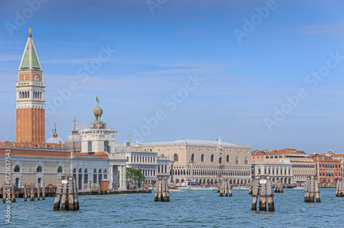 Venice cityscape from the Giudecca Canal: view of the Punta della Dogana with glimpse of St. Mark's Campanile and the Doge's Palace in Italy.