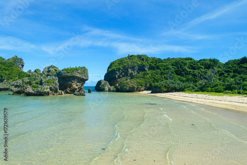 A clean small beach surrounded by natural reefs
