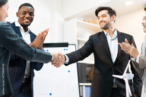 business handshake for welcoming teamwork to meeting collaboration agreement in financial office, with colleague partner clapping hands to celebrate successful partnership and business deal