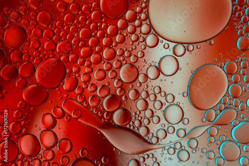 Close up of oil drops on water surface. Colorful abstract macro background of oil drops on water surface with air bubbles inside. Colorful background for gadget and computer wallpaper