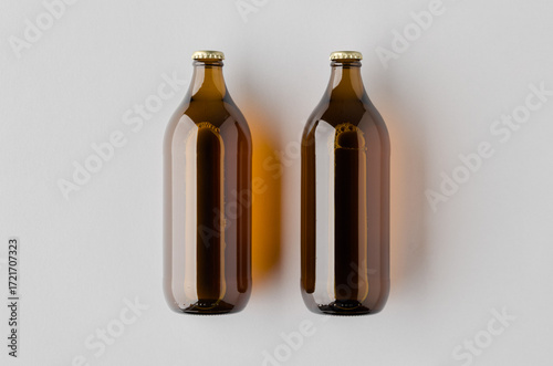 Mockup of a glass beer bottle on a neutral background.