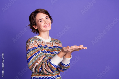 Obraz na plátně Photo of charming pretty woman wear stylish clothes hold empty space isolated on