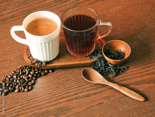 Hot coffee and hot tea on a wooden table