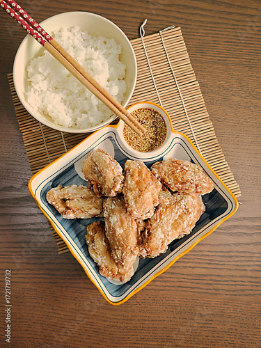 Japanese style fried chicken wings on a wooden table