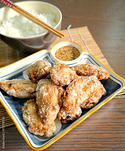 Japanese style fried chicken wings on a wooden table
