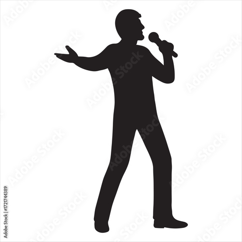 Silhouette of a male singer performing on stage holding a microphone and gesturing with his hand