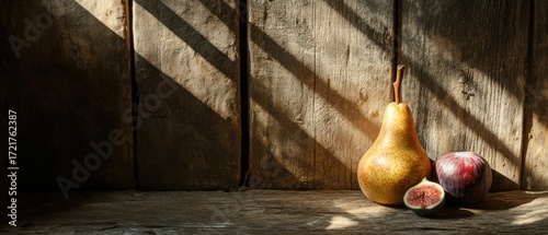 Rustic still life sunlit pears figs and plums on wooden table