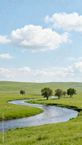 Serpentine river through green grassland