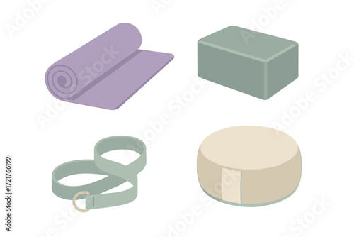 Yoga gear including mat, block, strap, and bolster displayed on a flat surface for practice preparation