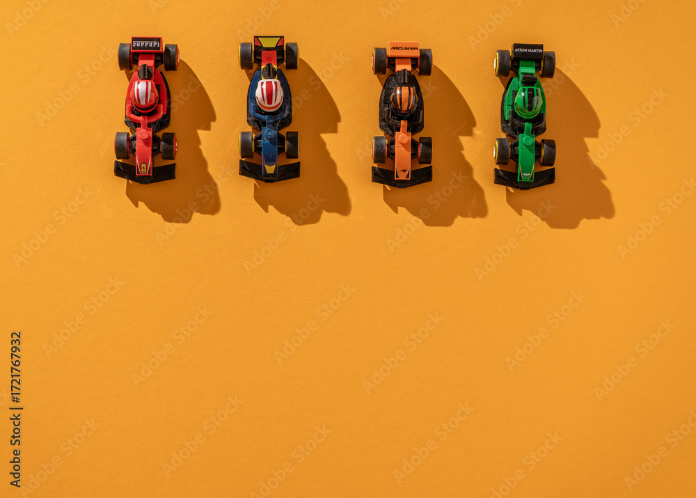 Fototapeta premium Ukraine, Kyiv - September 18, 2025: Toy car Formula 1 Lego set top view. Ferrari, Aston Martin McLaren formula one team race game