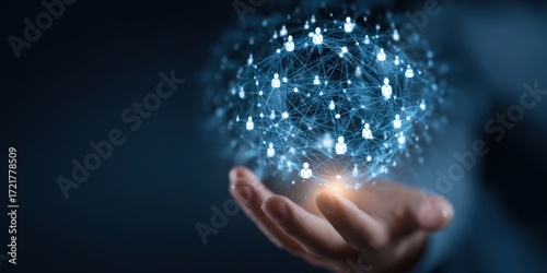 A hand holds a digital network sphere