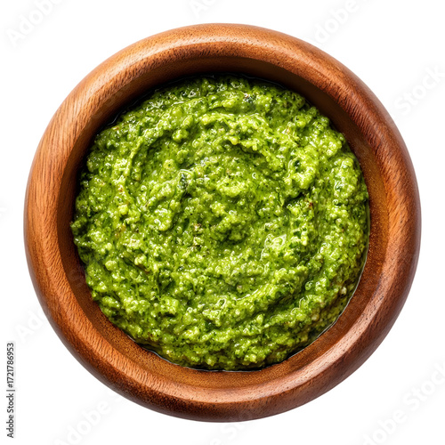 Green curry paste in wooden cup top view isolated on transparent background