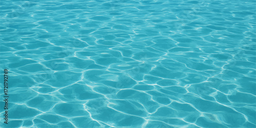 An abstract aqua texture of sunlight reflecting on the clear blue surface of a swimming pool