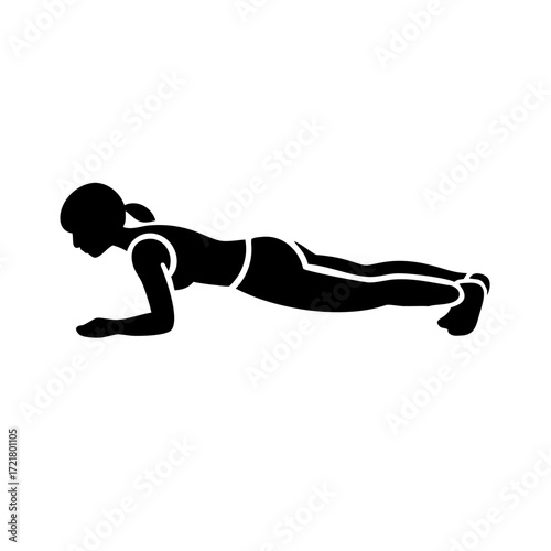 Woman doing plank exercise in workout position indoors  