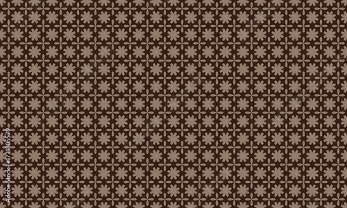 A seamless pattern with brown floral and geometric shapes on a dark brown colored background design