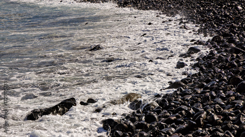 Volcanic Shoreline: Waves and Black Pebbles at Playa de la Arena, Tenerife