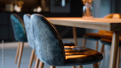 Close up of modern dining chairs and wooden table in a stylish setting