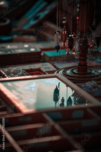 A stall selling objects at a village festival photographed up close with reflections and plays of light