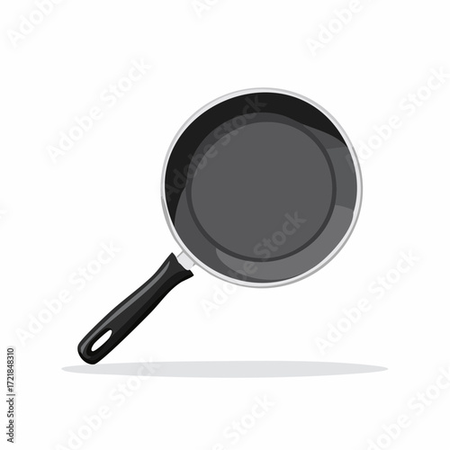 Top-Down View of a Non-Stick Frying Pan with a Black Handle for Cooking and Food Preparation