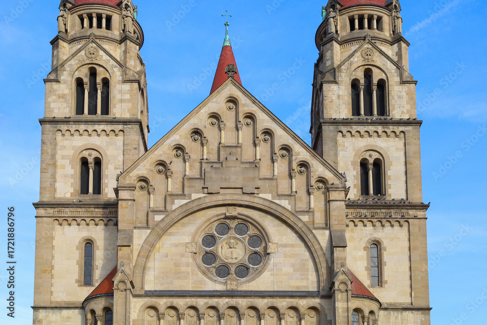 Fototapeta premium An ancient Christian church with a red roof. An ancient church with towers