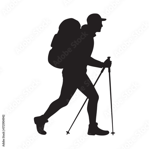 Silhouette of a hiker with a backpack and trekking poles