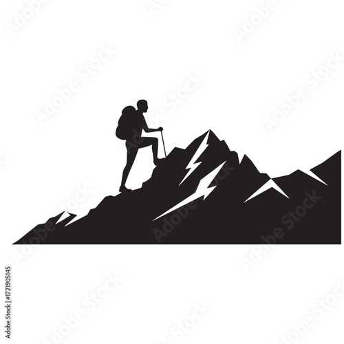 Silhouette of a hiker with a pole on a mountain trekking