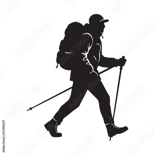 Silhouette of a hiker with poles walking on a mountain
