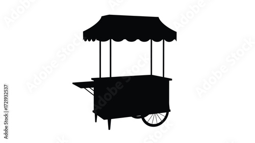 Silhouette of a classic street food cart with awning and wheels
