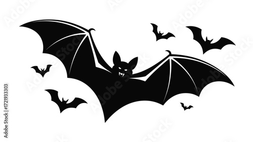 Silhouette of a large bat flying with smaller bats around it