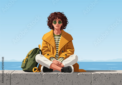 Relaxed Woman with Curly Hair and Backpack Sitting by the Sea with Sunglasses