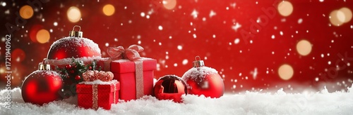 Decorative Christmas Gifts and Ornaments on Snowy Surface With Festive Backgr...
