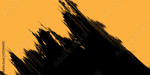 A beautiful summer sunset silhouettes a vast wheat field against an orange and yellow sky