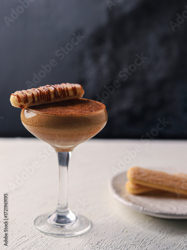 Elegant Tiramisu Inspired Cocktail with Wafer Garnish