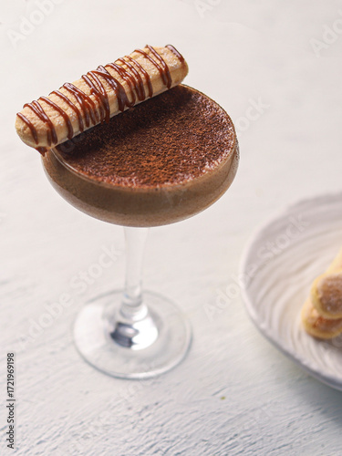 Elegant Tiramisu Inspired Cocktail with Wafer Garnish