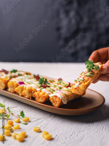 Loaded Corn Ribs with Cheese Sauce and Fresh Herbs