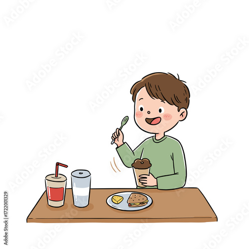Happy boy eating dessert and enjoying snacks at the table  