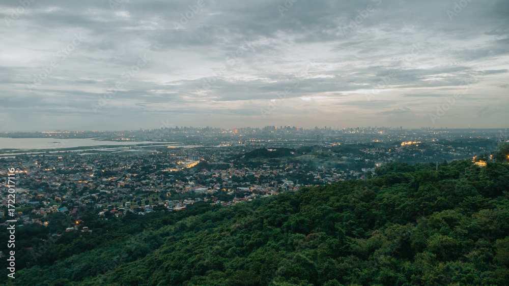 Obraz premium Overlooking of Metro Manila from Forested Hillside in Angono, Rizal, Philiippines