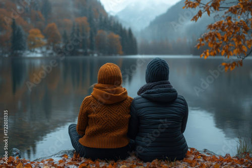 people sitting and gazing at a serene lake.
