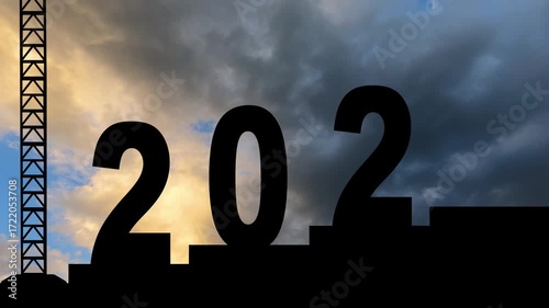 Group silhouette of engineers assembling 2025 to 2026 number with cranes while working together in construction site with moving clouds background. Shot in 4k resolution