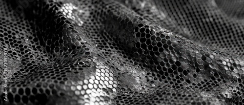 Textured fabric snakeskin pattern black white monochrome material surface detail