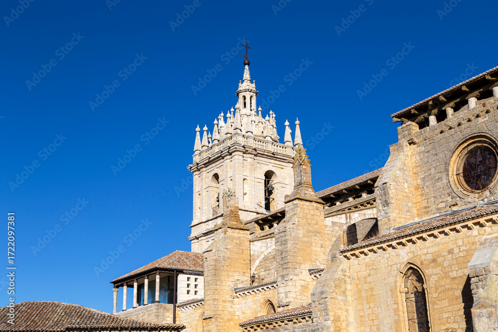 Fototapeta premium The magnificent Gothic tower with pinnacles of the historic Church of Saint Hippolytus in Támara de Campos, Palencia, Spain