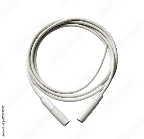 White cable coiled on black background, medical equipment, studio shot