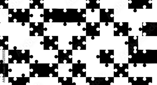 Black and white puzzle pieces create an abstract pattern of connection and challenge