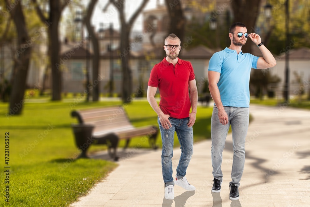 Fototapeta premium Happy cheerful friends young men walk outdoor