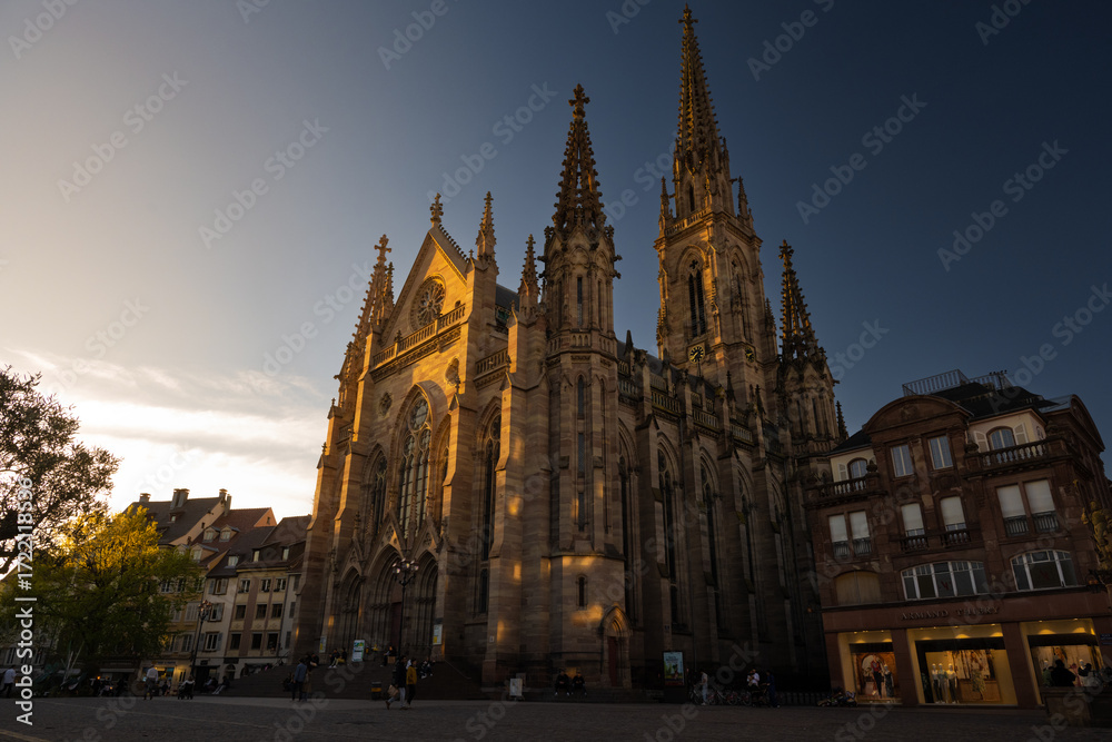 Fototapeta premium Historic Catholic church built in Gothic style with pointed arches and ornate details, perfect for architecture, culture, and heritage themes.