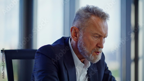 Wallpaper Mural Anxious senior manager pondering financial crisis solutions at workplace closeup Torontodigital.ca