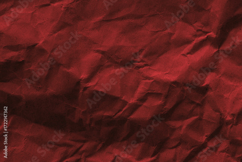 Red background old crumpled paper texture